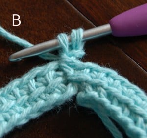 Purple crochet hook showing where to insert your hook to crochet a linked stitch.