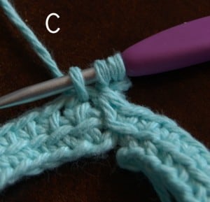 A linked double crochet stitch being worked into the first stitch.