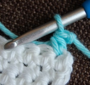 Small swatch showing how to join yarn with a standing half double crochet stitch.