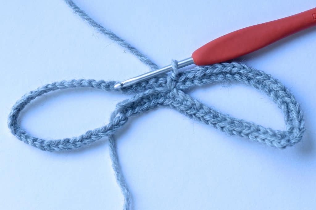 Chain with grey yarn to begin crochet mask.