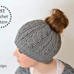 Free Crochet Pattern - Crochet Cabled Messy Bun Hat (Adult Sizes) (video tutorial included) by A Crocheted Simplicity