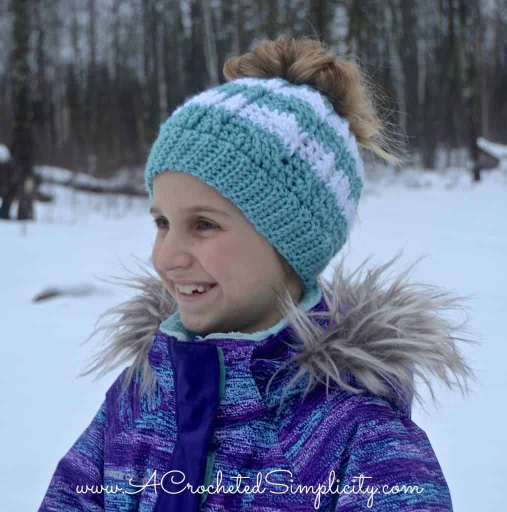 Free Crochet Pattern - Cabled Messy Bun Hat (video tutorial included) by A Crocheted Simplicity