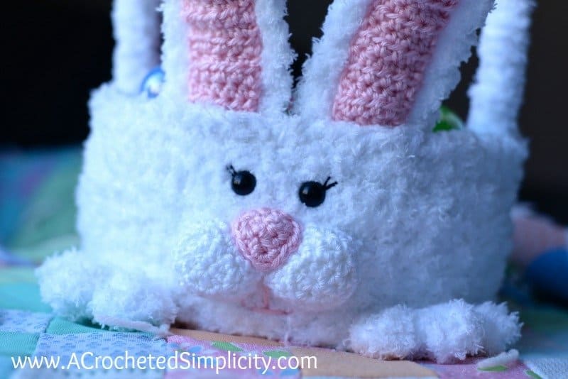 Close up of the face of an crochet Easter bunny basket.