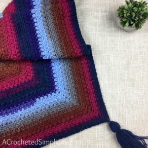 Free Crochet Pattern - Griffin Shawl / Triangular Scarf by A Crocheted Simplicity #crochet #freecrochetshawlpattern #freecrochetpattern #freecrochetscarf #triangularscarfpattern #lionbrandmandala #crochetshawl #crochetscarf #crochetshawlpattern #crochettriangularshawl