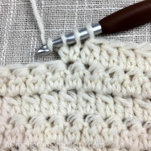 Learn to Crochet the 2 Double Crochet Cluster Stitch - Crochet Tutorial by A Crocheted Simplicity #crochetstitchtutorial #chainlesscrochetstitch #crochetclusterstitch #doublecrochetcluster #freecrochettutorial