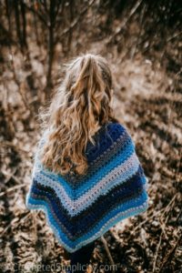 Free Crochet Pattern - Wasilla Poncho by A Crocheted Simplicity #freecrochetpattern #crochetponcho #crochet #girlsponcho #lionbrandmandala #crochetponchopattern