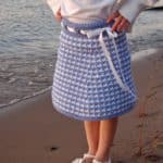 Crochet Skirt Pattern - Houndstooth Girls Skirt by A Crocheted Simplicity #crochetskirt #houndstooth #houndstoothcrochet #crochetskirtpattern #crochetforgirls #girlshoundstoothskirt #handmadeskirt