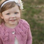 Girls Crochet Cabled Cardigan Pattern - Southern Charm Girls Cardigan by A Crocheted Simplicity #crochetcardigan #crochetforgirls #cabledcardigan #crochetcables #horseshoecables #crochetsweater #girlscardigan #cables #handmadecardigan