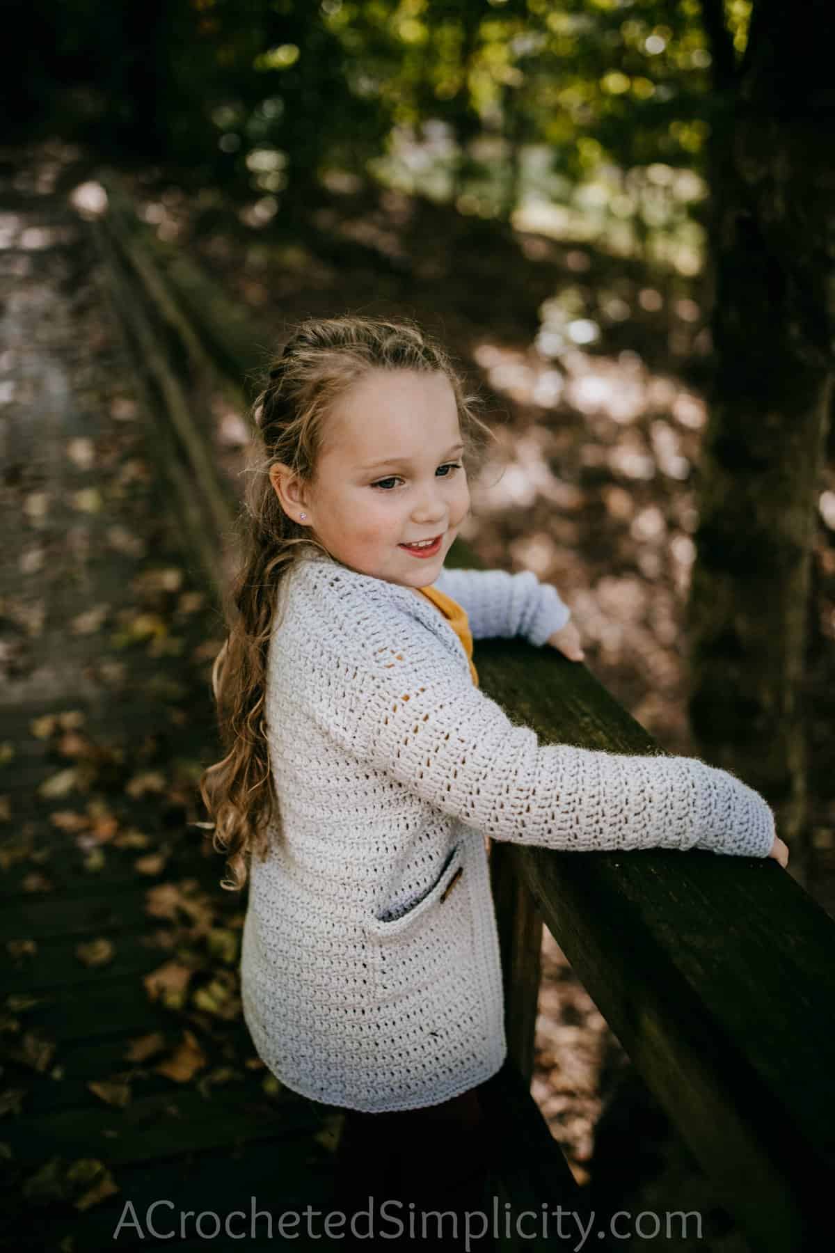 Free Crochet Cardigan Pattern - Aurora Cardigan for Girls by A Crocheted Simplicity #crochet #crochetcardigan #crochetcardiganpattern #freecrochetpattern #crochetsweater #crochetgirlscardigan #handmadecardigan #homemade