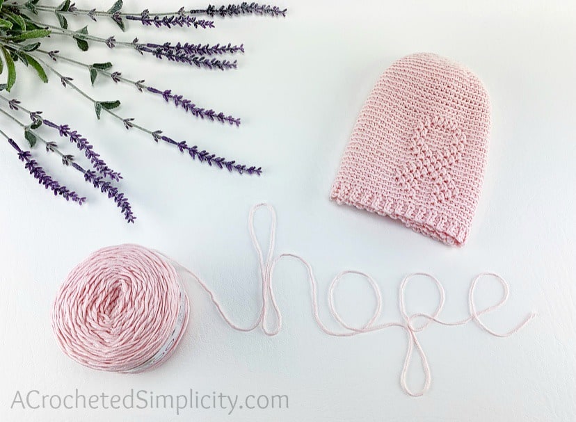 Free Crochet Beanie Pattern - Awareness Ribbon Beanie Crochet Pattern by A Crocheted Simplicity #freecrochetpattern #freecrochetbeaniepattern #crochetawarenesshat #awarenessribbon #awarenessribbonbeanie #cancerawarenessbeanie #chemocap #crochetchemocap #crochetcancerhat #raiseawareness