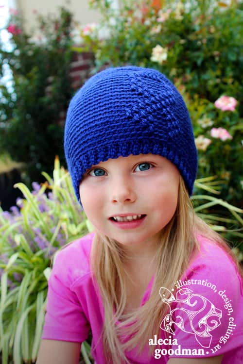 Free Crochet Beanie Pattern - Awareness Ribbon Beanie Crochet Pattern by A Crocheted Simplicity #freecrochetpattern #freecrochetbeaniepattern #crochetawarenesshat #awarenessribbon #awarenessribbonbeanie #cancerawarenessbeanie #chemocap #crochetchemocap #crochetcancerhat #raiseawareness