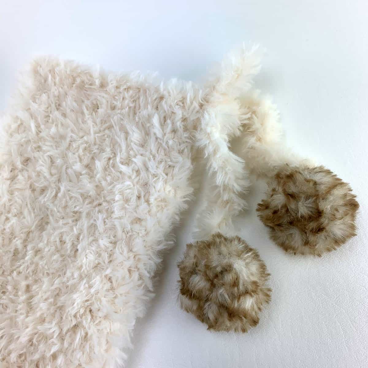 Crochet Faux Fur Pom Pom with Lion Brand Go For Faux Yarn - Left in Knots