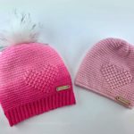 Pink ombre crocheted slouch hat with an embossed heart and light pink embossed crochet heart beanie.