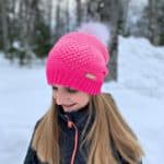 Crochet ombre pink heart slouch hat modeled by young girl.