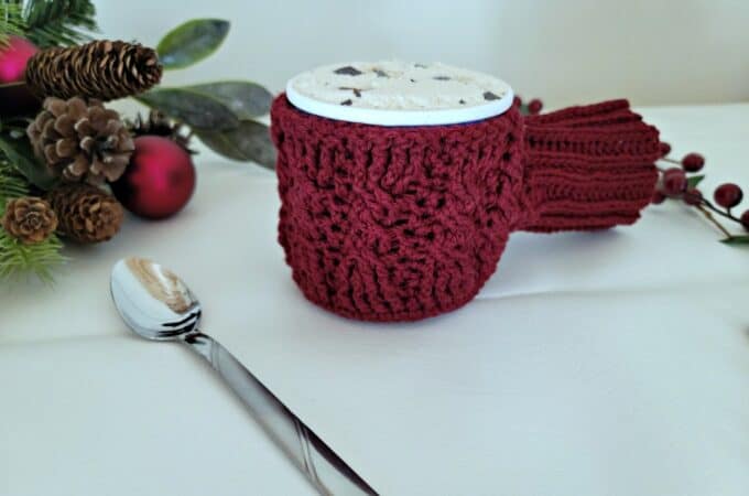 Free Crochet Drink Mitt Pattern - Cabled Sweater Ice Cream Cozy & Drink Mitt by A Crocheted Simplicity #freecrochetpattern #cozyholidaycal #crozydrinkmitt #crochetdrinkmittpattern #crochetcables