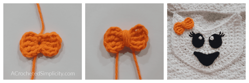A small orange crochet bow added to the face of a happy ghost.