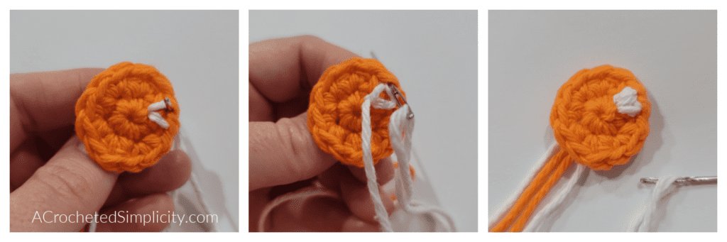 Crochet ghost eyes shown in bright orange yarn.