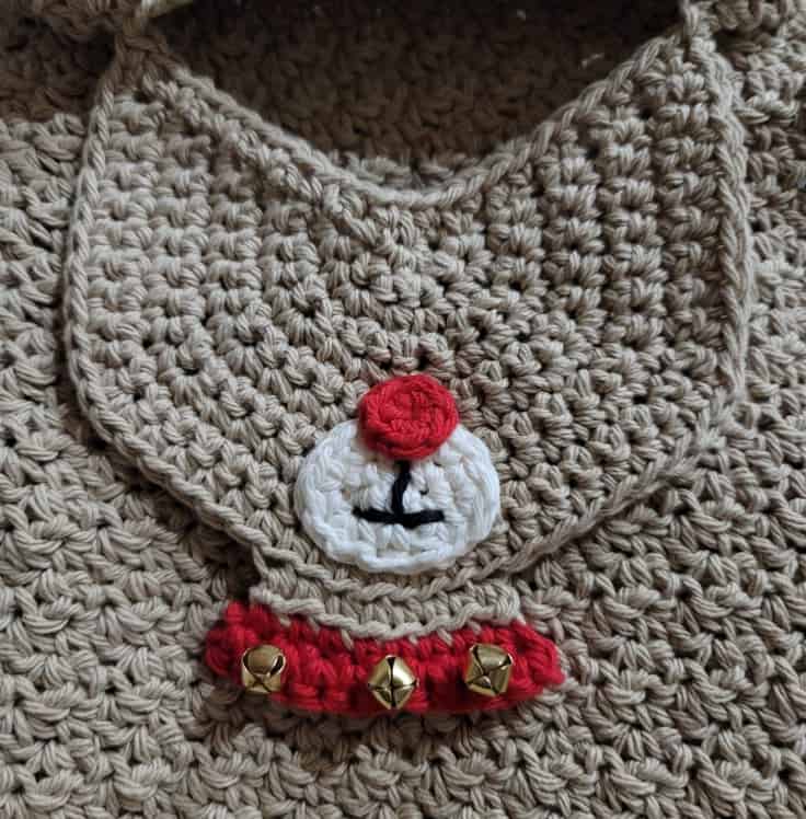 Crochet reindeer face with muzzle, red nose, mouth, neck and jingle bells on collar.