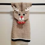 Crochet reindeer kitchen towel hanging on towel bar
