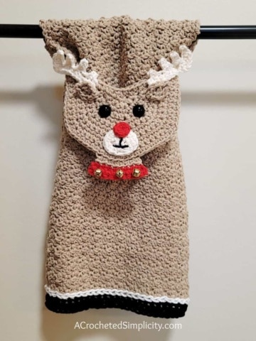 Crochet reindeer kitchen towel hanging on towel bar