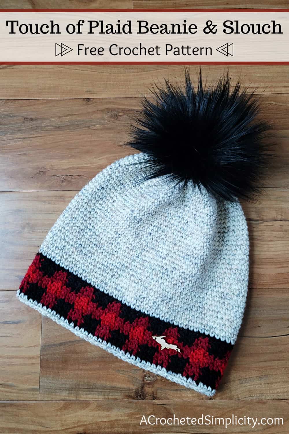 Crochet hat with buffalo plaid band and big black faux fur pom.