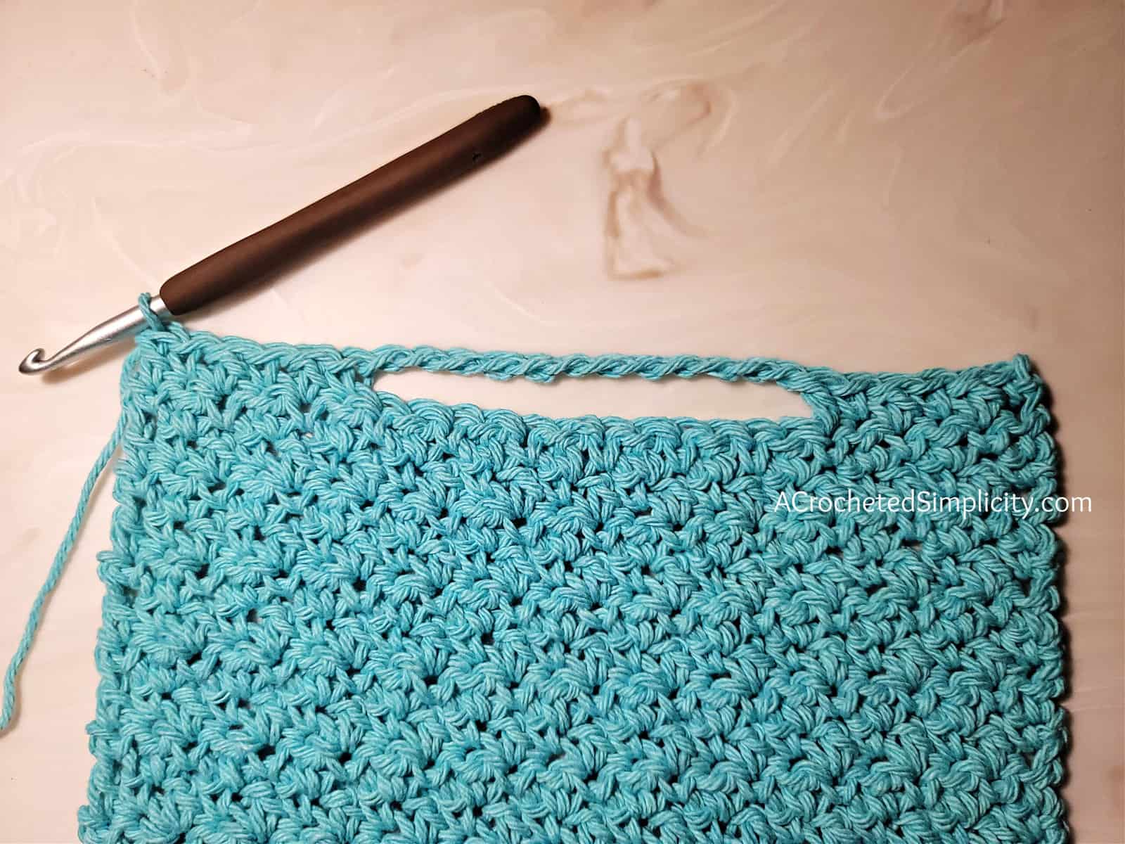 Free Crochet Towel Pattern - Basic Keyhole Kitchen Towel by A Crocheted Simplicity #freecrochetpattern #freecrochettowelpattern #keyhole #keyholetowel #keyholehandtowel #stayputtowel #stayputcrochettowel #keyholetowel #keyholecrochettowel #handmadetowel #crochettowlpattern #crochethandtowel #farmhousekitchentowel #farmhousestripes #crochethandtowel