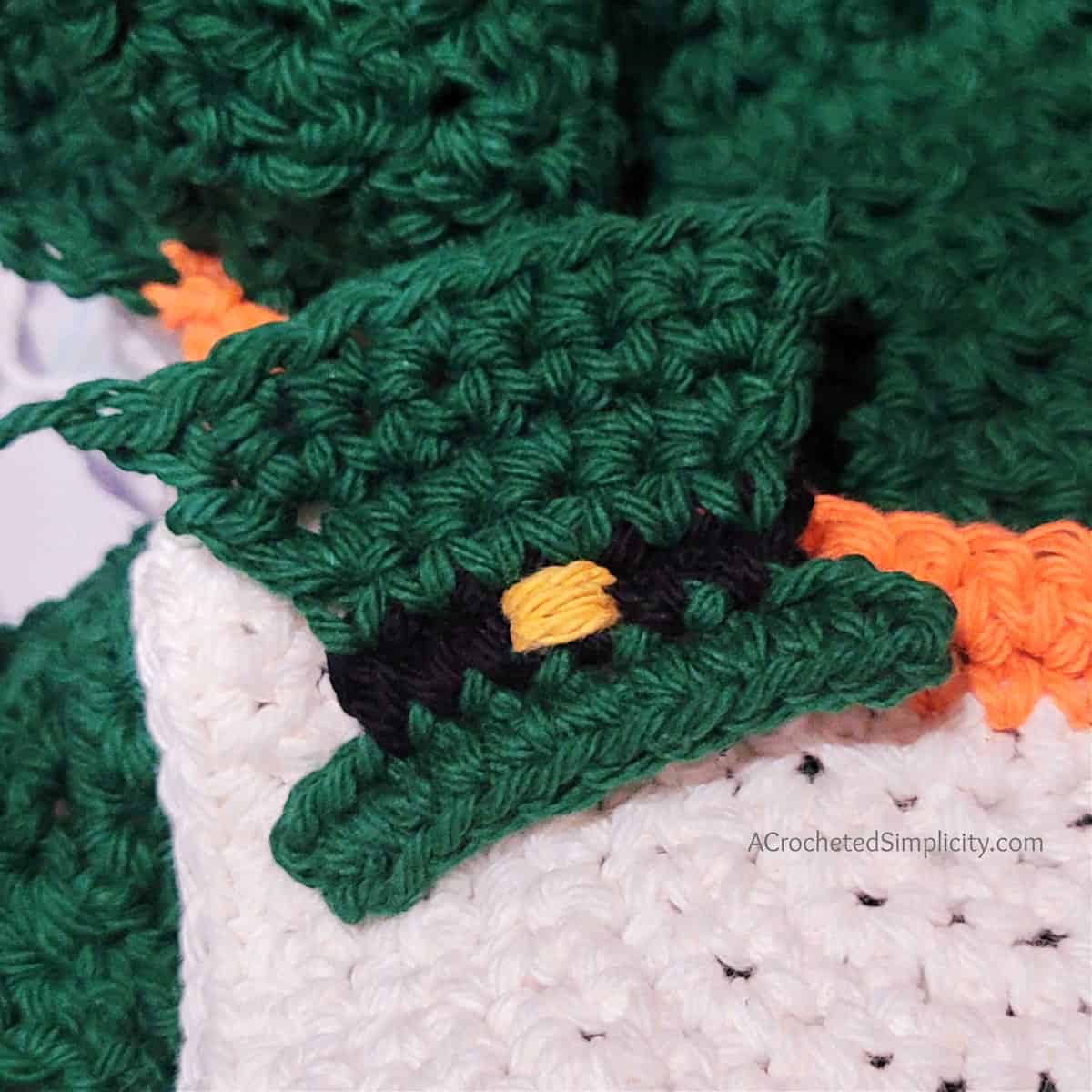 Free Crochet Pattern - Leprechaun Kitchen Towel by A Crocheted Simplicity #crochet #freecrochetpattern #crochetleprechaun #crochethandtowel #crochetkitchentowel #freecrochetleprechaun #freecrochettowel #stpaddystowel #kitchentowel #leprechaundecorations