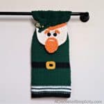 Crochet Leprechaun towel hanging on a towel bar.