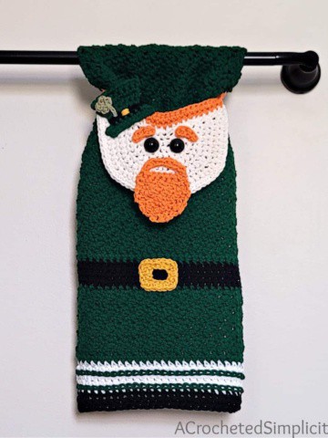 Crochet Leprechaun towel hanging on a towel bar.