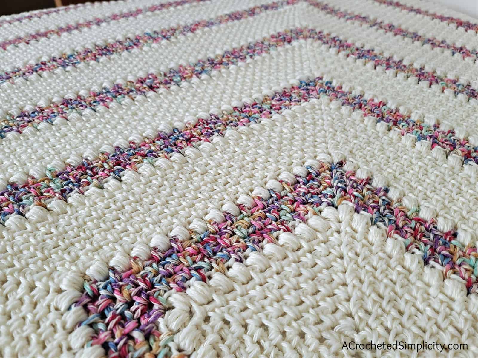 Free Crochet Blanket Pattern - Elayna's Afghan by A Crocheted Simplicity #freecrochetpattern #freecrochetblanketpattern #crochetlapghanpattern #crochetblanketpattern #crochet #crochetlapghan #crochetafghan #crochetpuffstitch #crochetlinenstitch