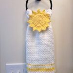 Free Crochet Towel Pattern - Hello Sunshine Keyhole Hand Towel by A Crocheted Simplicity #freecrochetpattern #freecrochettowelpattern #stayputtowel #stayputcrochettowel #keyholetowel #keyholecrochettowel #handmadetowel #crochettowelpattern #crochethandtowel #crochetlinenstitch #kitchentowel #crochetsun #sunhandtowel #summertowel #crochethandtowel