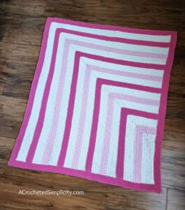 Free Crochet Blanket Pattern - Bubblegum Kisses Baby Blanket by A Crocheted Simplicity #freecrochetpattern #freecrochetblanketpattern #crochetlapghanpattern #crochetblanketpattern #crochet #crochetlapghan #crochetafghan #crochetpuffstitch #homemadeafghan #crochettexture #crochetbabyblanket #crochetblanketpattern #babyblanketpattern #freebabyblanket