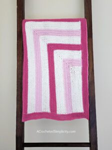 Free Crochet Blanket Pattern - Bubblegum Kisses Baby Blanket by A Crocheted Simplicity #freecrochetpattern #freecrochetblanketpattern #crochetlapghanpattern #crochetblanketpattern #crochet #crochetlapghan #crochetafghan #crochetpuffstitch #homemadeafghan #crochettexture #crochetbabyblanket #crochetblanketpattern #babyblanketpattern #freebabyblanket