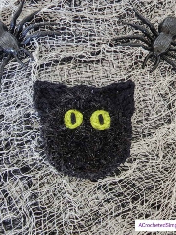 Free Crochet Pattern - Black Cat Dish Scrubby by A Crocheted Simplicity #freecrochetpattern #crochetscrubby #crochetscrubbypattern #crochetdishscrubby #halloweencrochet #crochetblackcat #blackcat #crochetkitchen #crochet #handmade #halloweencrochet