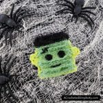 Free Crochet Pattern - Frankenstein's Monster Dish Scrubby by A Crocheted Simplicity #freecrochetpattern #crochetscrubby #crochetscrubbypattern #crochetdishscrubby #halloweencrochet #crochetblackcat #blackcat #crochetkitchen #crochet #handmade #halloweencrochet #crochetghost #ghost #ghostdecor #frankensteinsmonster