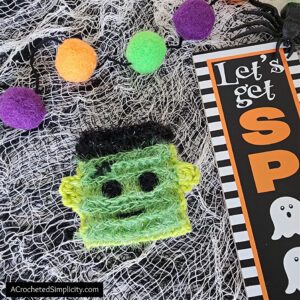 Free Crochet Pattern - Black Cat Dish Scrubby by A Crocheted Simplicity #freecrochetpattern #crochetscrubby #crochetscrubbypattern #crochetdishscrubby #halloweencrochet #crochetblackcat #blackcat #crochetkitchen #crochet #handmade #halloweencrochet #crochetghost #ghost #ghostdecor