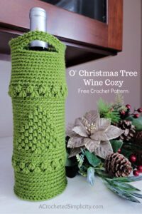 Free Crochet Wine Tote Pattern - O' Christmas Tree Wine Tote by A Crocheted Simplicity. #crochetchristmas #handmadechristmas #crochetwinetote #crochetwinecozy #winetote #winecozy #christmaswinetote #crochetchristmaswinetote #crochetchristmastree #freecrochetpattern #winetotepattern #crochetwinetotepattern #lastminutecrochetgifts 