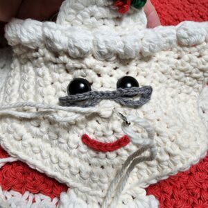 Mrs. Claus Kitchen Towel - Free Crochet Christmas Pattern by A Crocheted Simplicity. #freecrochetpattern #crochetchristmaspattern #freecrochetchristmaspattern #freecrochetmrsclauspattern #mrsclauscrochetpattern #crochetmrsclaus #handmadechristmas #crochettowel #crochetchristmastowel #santaclauscrochet #crochetsantaclaus