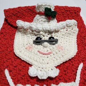 Mrs. Claus Kitchen Towel - Free Crochet Christmas Pattern by A Crocheted Simplicity. #freecrochetpattern #crochetchristmaspattern #freecrochetchristmaspattern #freecrochetmrsclauspattern #mrsclauscrochetpattern #crochetmrsclaus #handmadechristmas #crochettowel #crochetchristmastowel #santaclauscrochet #crochetsantaclaus