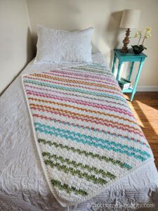 Candy Stripes Afghan - Free Crochet C2C Blanket Pattern by A Crocheted Simplicity #freecrochetpattern #freeblanketpattern #crochetblanketpattern #crochetc2c #crochetcornertocorner #c2cblanket #cornertocornerblanket #onthebias #crochet #handmadeblanket #stripedcrochet #texturedcrochetblanket #moderncrochetblanket #crochetstripes