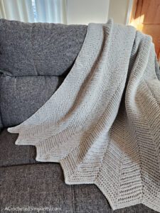 Herringbone Single Crochet Ripple Stitch Blanket - Free Herringbone Crochet Blanket Pattern by A Crocheted Simplicity #crochetherringbonestitch #herringbonesinglecrochet #herringbonecrochetblanket #freecrochetblanketpattern #crochetrippleblanket #crochetchevronblanket #crochetrippleafghan #crochetripplestitch #freecrochetblanketpattern #herringbonesinglecrochetrippleblanket #handmadeblanket #crochetlapghan