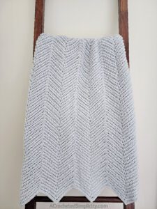 Herringbone Single Crochet Ripple Stitch Blanket - Free Herringbone Crochet Blanket Pattern by A Crocheted Simplicity #crochetherringbonestitch #herringbonesinglecrochet #herringbonecrochetblanket #freecrochetblanketpattern #crochetrippleblanket #crochetchevronblanket #crochetrippleafghan #crochetripplestitch #freecrochetblanketpattern #herringbonesinglecrochetrippleblanket #handmadeblanket #crochetlapghan