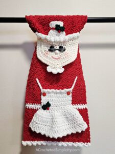 Mrs. Claus Kitchen Towel - Free Crochet Christmas Pattern by A Crocheted Simplicity. #freecrochetpattern #crochetchristmaspattern #freecrochetchristmaspattern #freecrochetmrsclauspattern #mrsclauscrochetpattern #crochetmrsclaus #handmadechristmas #crochettowel #crochetchristmastowel #santaclauscrochet #crochetsantaclaus