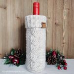 Cabled crochet wine cozy and holiday decor.