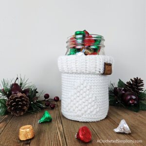 Crochet Mason Jar Cozy - O' Christmas Tree Jar Cozy - Free Crochet Jar Cozy Pattern by A Crocheted Simplicity #freecrochetpattern #crochetmasonjarcozy #crochetjarcozy #crochetjarcozypattern #christmasmasonjarcozy #crochetchristmas #christmasdecor #crochetchristmasdecor #crochettreedecor #crochetcandydish #crochetbasket #crochetcandybasket #crochetcandlecozy #freemasonjarcozypattern #handmadechristmas #lastminutecrochetgift #quickcrochet
