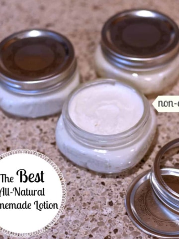 Three small canning jars with homemade lotion sitting on kitchen counter.