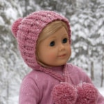 18" doll wearing a pink winter crochet hat.