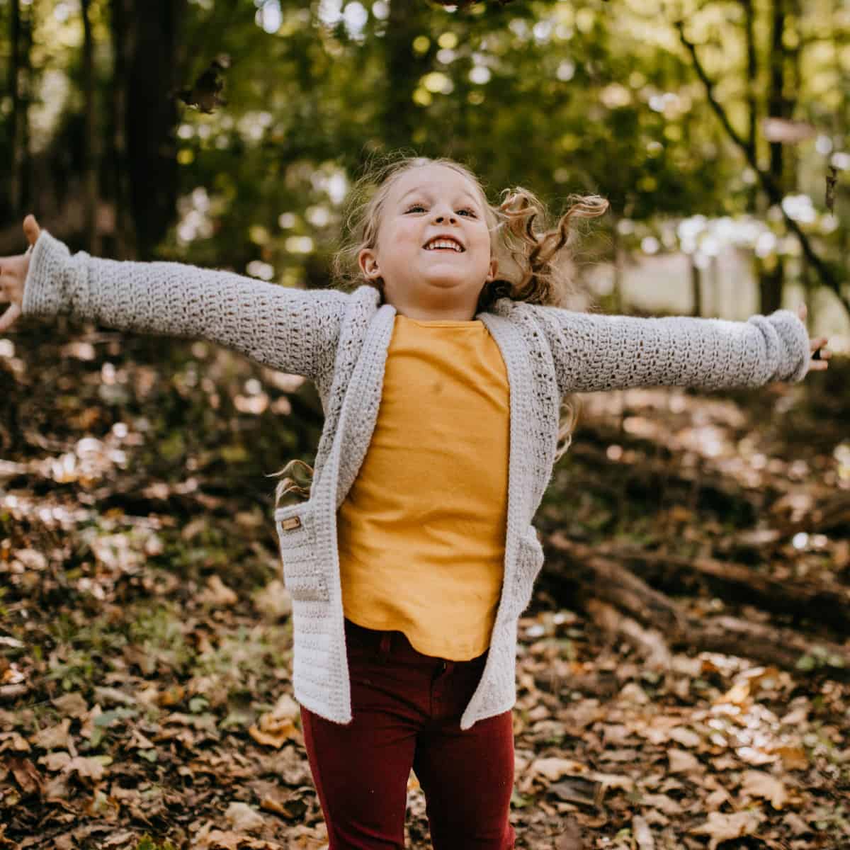 kid in crochet sweater