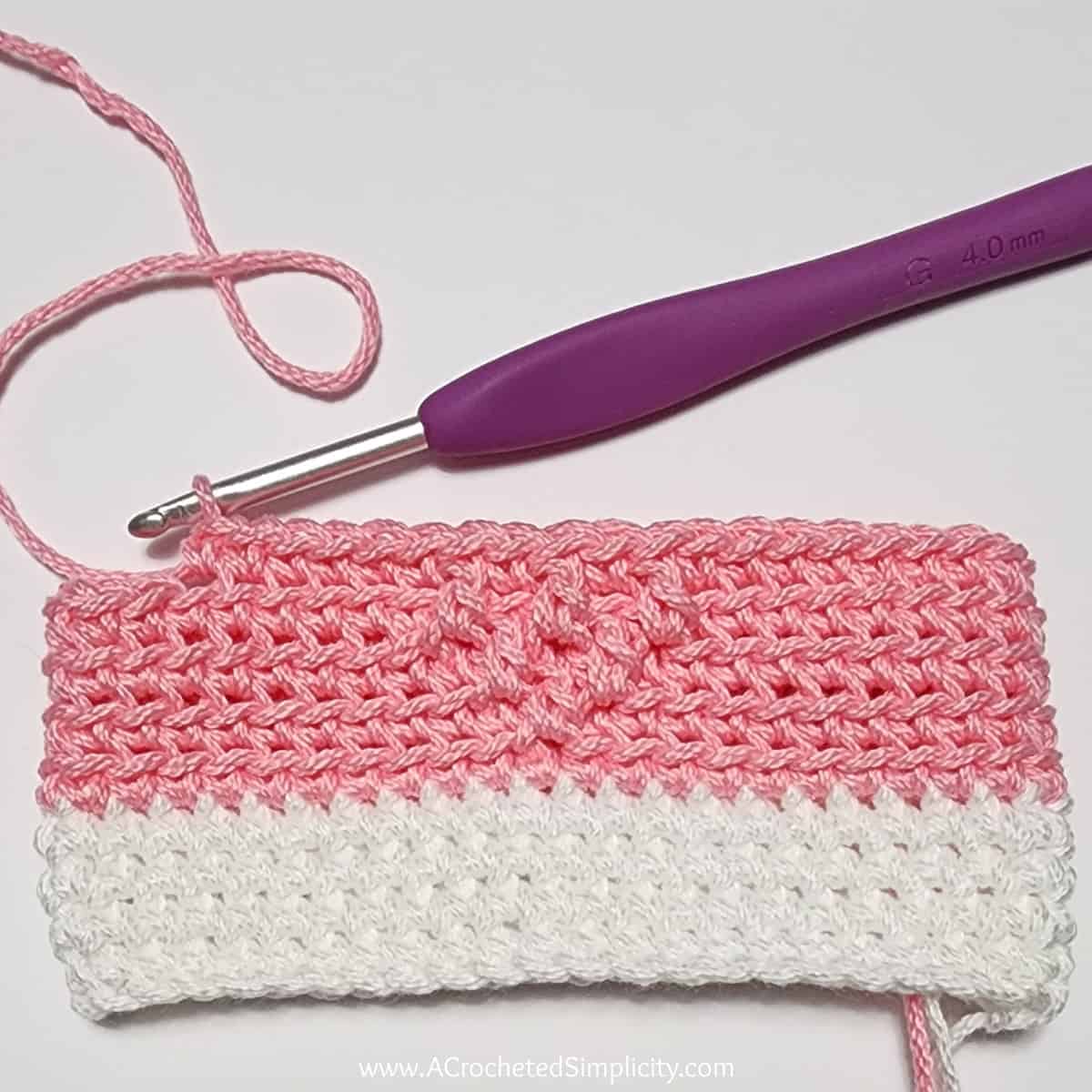 Crochet Valentine's treat bag tutorial showing round 3 complete.