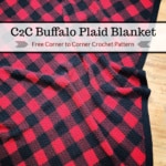 Image showing crochet buffalo plaid c2c blanket on wood flooring.